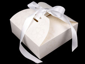 Geschenkschachtel aus Papier mit Schleife und Glitzer