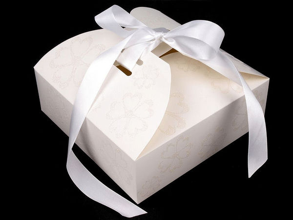 Geschenkschachtel aus Papier mit Schleife und Glitzer